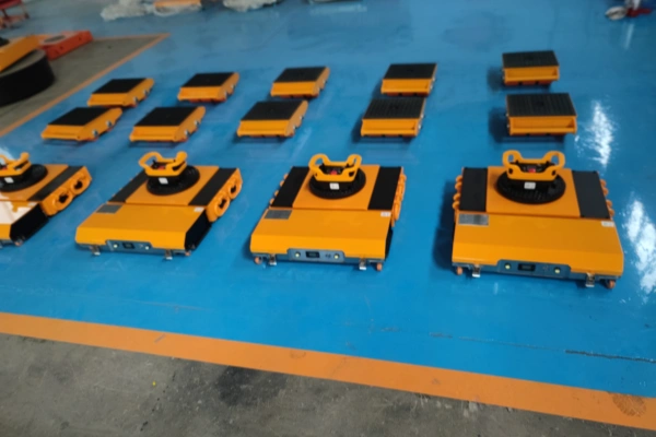 The Electric Machine Dolly Skate enables remote-controlled movement of loads up to 50 tonnes, eliminating the need for additional push or pull equipment. Its three-point support design allows simultaneous driving and steering at speeds up to 8 m/min, with precise speed adjustment and safe positioning via the remote control’s single-joystick proportional function. Powered by state-of-the-art 48 V, 60 Ah lithium-iron phosphate batteries, the Electric Machine Dolly Skate delivers a minimum 3-hour runtime under full load and can negotiate gradients of 2–3%.